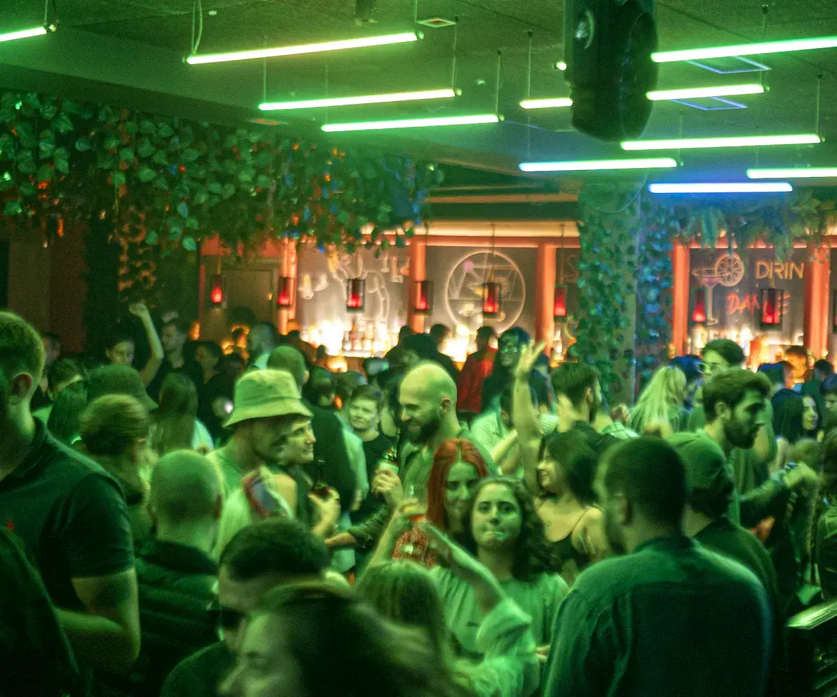 Busy nightclub floor tonight under green lights at Sakhelosno Tbilisi