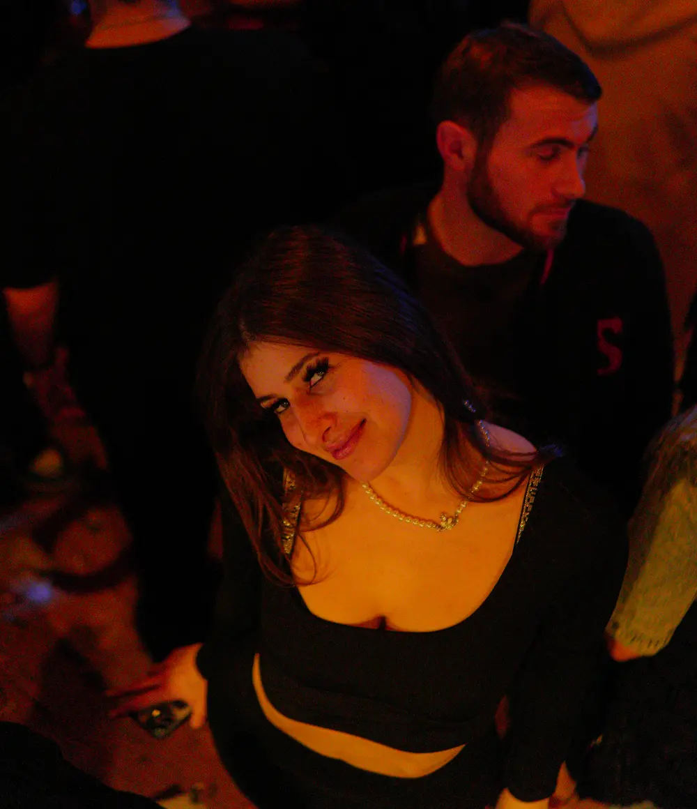 Smiling guest on a night out at Sakhelosno Tbilisi